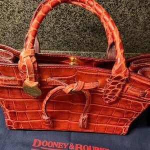 Dooney & Bourke Red small tassell Embossed Leather Tote. New. Leather